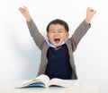 Excited little boy is reading book Royalty Free Stock Photo