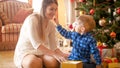 Excited little boy showing his mother a toy he received for Christmas Royalty Free Stock Photo
