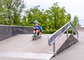 Excited little boy trying out his new skateboard Royalty Free Stock Photo