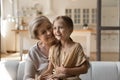 Excited little girl grandchild sit on loving mature grandmother knees Royalty Free Stock Photo