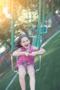 Happy girl riding carousel in park Royalty Free Stock Photo