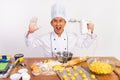 excited male chef holding mixer with camera startling gesture Royalty Free Stock Photo