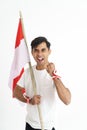 Excited male holding indonesian flag