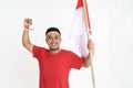 Excited male holding indonesian flag