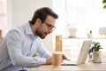 Excited male look at laptop screen reading great news online