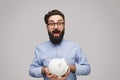 Excited male with piggy bank Royalty Free Stock Photo