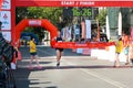 Excited male runner crossing the finshline of a marathon Royalty Free Stock Photo