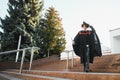 Excited male student in mantle scream graduate from university finish course studying. Happy man triumph holding college Royalty Free Stock Photo