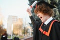 Excited male student in mantle scream graduate from university finish course studying. Happy man triumph holding college Royalty Free Stock Photo