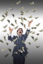 Excited man catching money falling around him Royalty Free Stock Photo