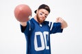 Excited man fan pointing at you holding rugby ball. Royalty Free Stock Photo