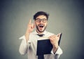 Excited man having idea while reading a book Royalty Free Stock Photo