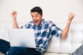 Excited man looking game on laptop Royalty Free Stock Photo