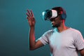 Excited man playing virtual game on interactive vr headset Royalty Free Stock Photo