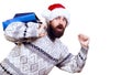 Excited man ready for Christmas Sale. Bearded man dressed in winter sweater and christmas hat. Winter sales. Shopper man running