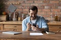 Excited man check email on smartphone receive attractive job offer