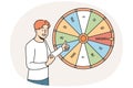 Excited man win money in fortune wheel Royalty Free Stock Photo