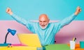 Excited Mature businessman sitting at the table typing on laptop computer working with new business plan. Senior man Royalty Free Stock Photo