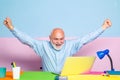 Excited Mature businessman sitting at the table typing on laptop computer working with new business plan. Senior man Royalty Free Stock Photo