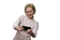 Excited mature woman playing video games on her smartphone. Royalty Free Stock Photo