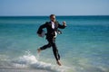 Excited millennial hispanic business man in suit on sea. Summer vacation, business on sea beach. 40s business man on Royalty Free Stock Photo