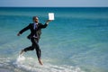 Excited millennial hispanic business man in suit on sea. Summer vacation, business on sea beach. 40s business man on Royalty Free Stock Photo