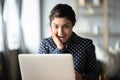 Excited millennial indian woman reading unbelievable news. Royalty Free Stock Photo