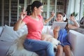 Excited mother and daughter using digital tablet and dancing Royalty Free Stock Photo