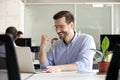 Excited motivated worker happy by receiving good news in email