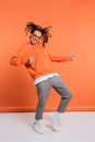 excited multiracial man in hoodie wearing