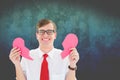 Excited nerd man holding pink broken heart