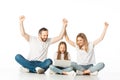 Excited parents sitting on floor near