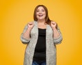 Excited plus size lady clenching fists Royalty Free Stock Photo