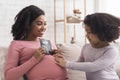 Excited Pregnant Black Woman Showing Baby Ultrasound Scan To Her Daughter Royalty Free Stock Photo