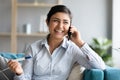 Excited pregnant indian woman holding pregnancy test calling husband