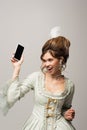 excited retro style woman holding mobile