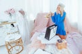 Excited rich girl shopping flamboyant bedroom Royalty Free Stock Photo