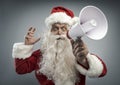 Excited Santa shouting a message with a megaphone