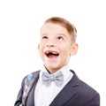 Excited school boy with toothless smile looking up