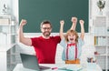 Excited school kid and teacher learning study in class. Education and knowledge.