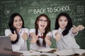 Excited schoolgirls showing OK sign Royalty Free Stock Photo