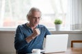 Excited senior man happy reading good news at laptop Royalty Free Stock Photo