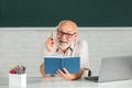 Excited senior teacher lecturer greeting students at workshop. Amazed surprised face of funny professor. Adult learning. Royalty Free Stock Photo