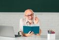 Excited senior teacher lecturer greeting students at workshop. Amazed surprised face of funny professor. Adult learning. Royalty Free Stock Photo