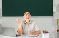 Excited senior teacher lecturer greeting students at workshop. Amazed surprised face of funny professor. Adult teaching. Royalty Free Stock Photo