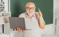 Excited senior teacher lecturer greeting students at workshop. Amazed surprised face of funny professor. Elderly Royalty Free Stock Photo