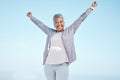 Excited senior woman with hands in air for exercise, fitness or workout portrait goals, success and achievement on blue Royalty Free Stock Photo