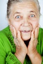 Excited senior woman with surprise expression Royalty Free Stock Photo
