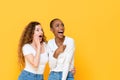 Excited shocked interracial woman friends