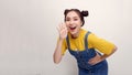 Excited shocked young woman 20s posing screaming with hands gesture near mouth looking camera isolated on white background Royalty Free Stock Photo